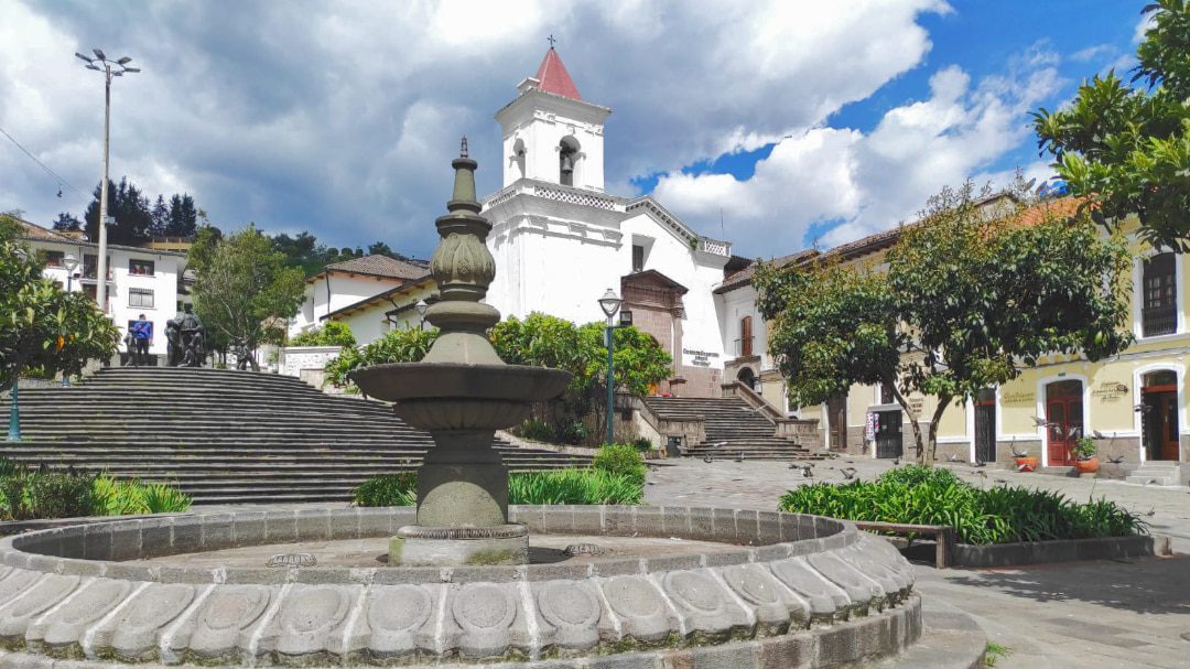 The San Blas Church with its fountain on a partly cloudy day
